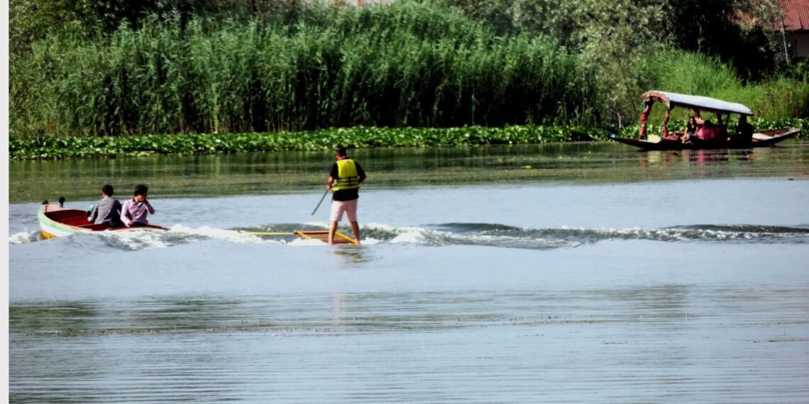 Amid soaring temperature youth take dip in Dal Lake Srinagar