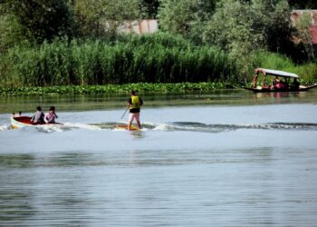 Amid soaring temperature youth take dip in Dal Lake Srinagar