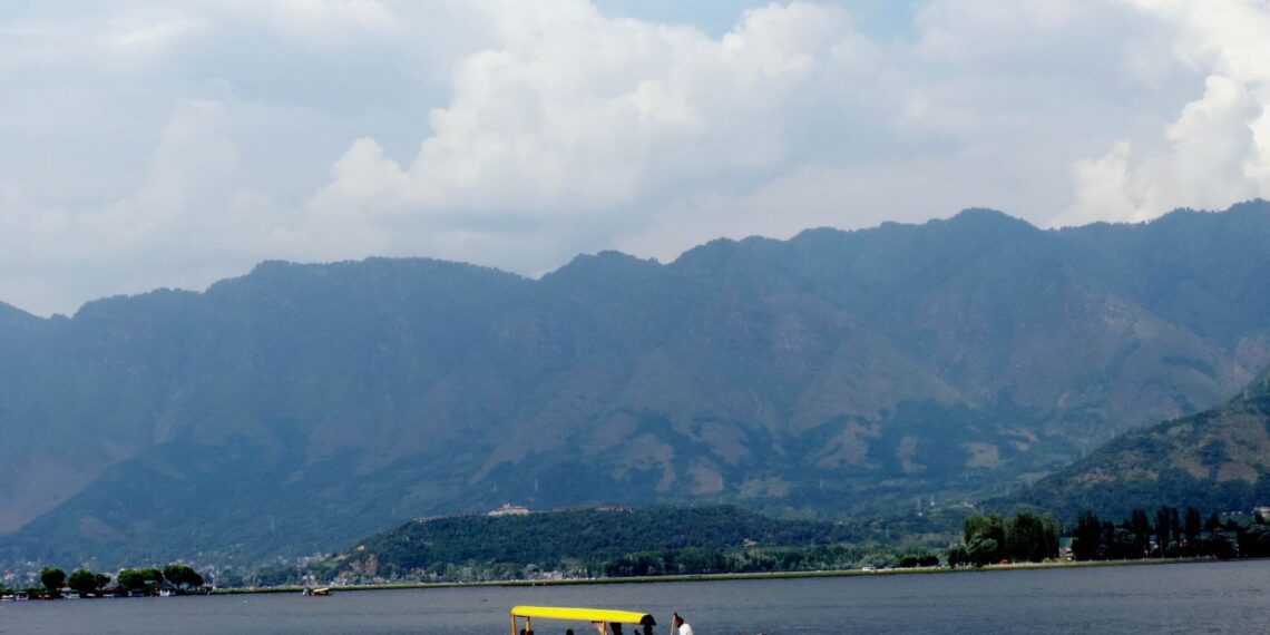 Amid soaring temperature youth take dip in Dal Lake Srinagar