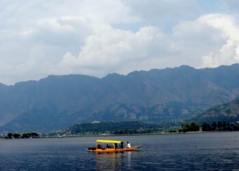 Amid soaring temperature youth take dip in Dal Lake Srinagar
