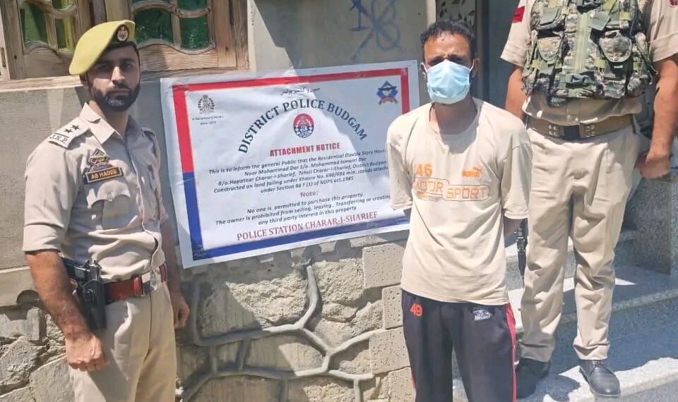 Police attach two storey residential house under NDPS Act in Budgam