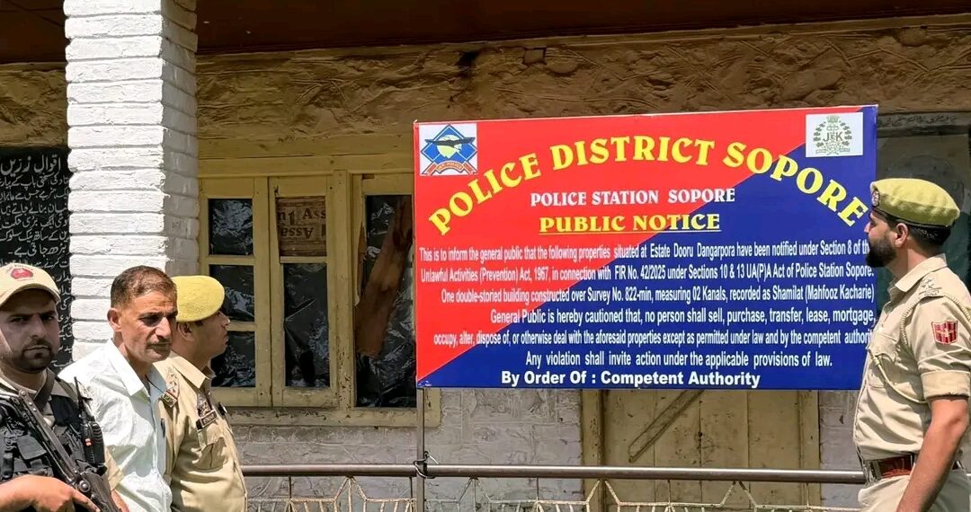 Police attach JeI-Linked Properties in Sopore ; Two Buildings, Six Shops and 02 Kanals of Land 