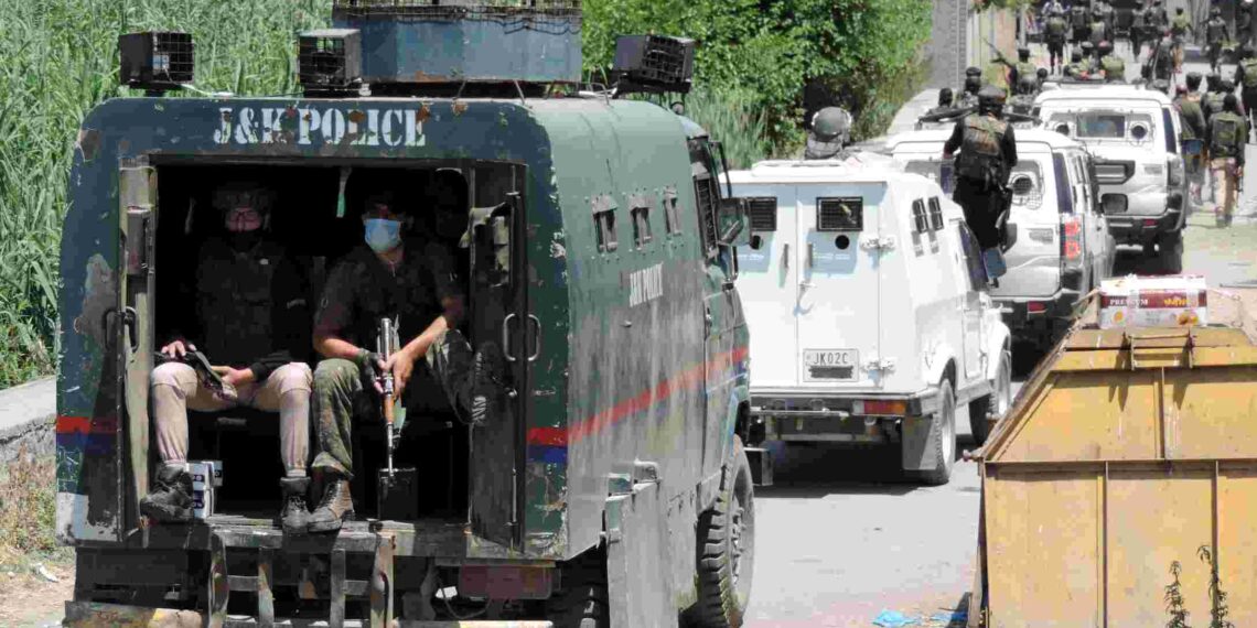 Security force vehicles near an encounter site in Srinagar