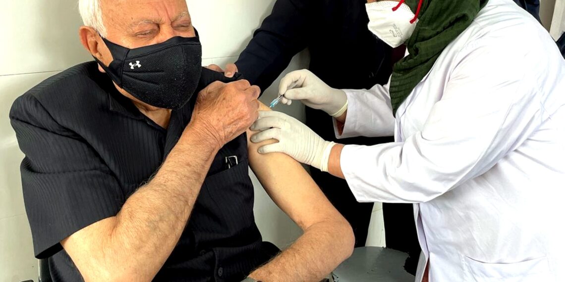 Farooq, wife receive COVID-19 vaccine shots at SKIMS