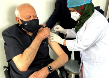 Farooq, wife receive COVID-19 vaccine shots at SKIMS