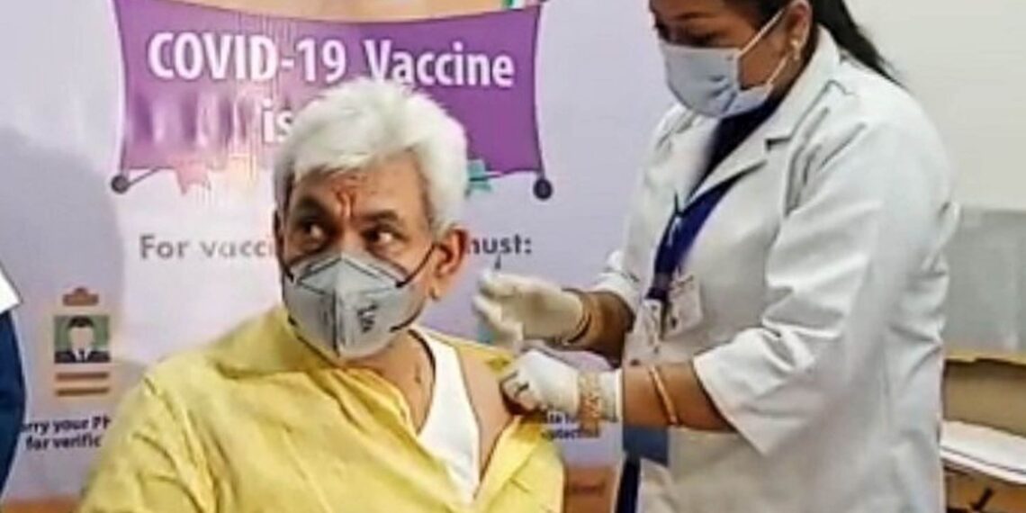 Lt Governor Manoj Sinha gets his first dose of Covid-19 vaccine at GMC Jammu 