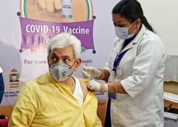 Lt Governor Manoj Sinha gets his first dose of Covid-19 vaccine at GMC Jammu 