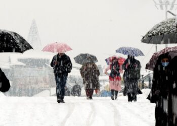 Srinagar received heavy snow fall disrupting the normal life on Tuesday