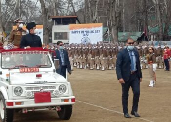 Advisor Bhatnagar unfurls National Flag on Republic Day at SK Stadium, Srinagar