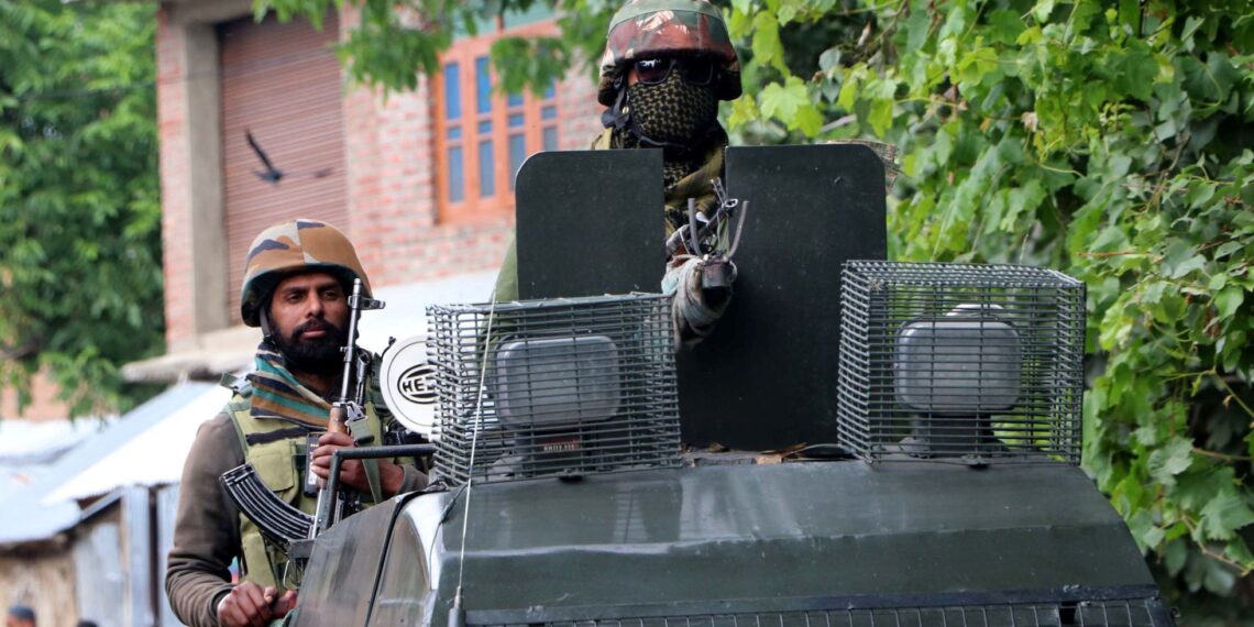 Army personnel at the encounter site in Khanday Pora in Kulgam