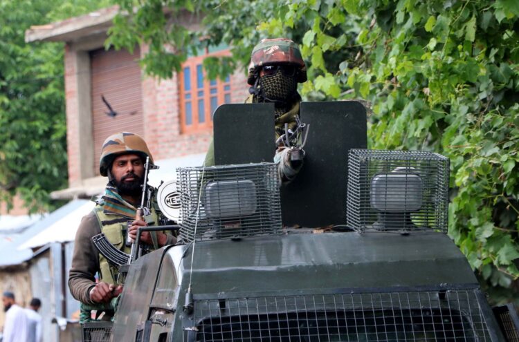 Army personnel at the encounter site in Khanday Pora in Kulgam