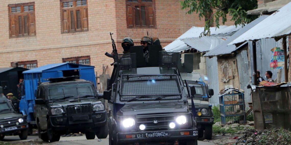 Army personnel at the encounter site in Khanday Pora in Kulgam
