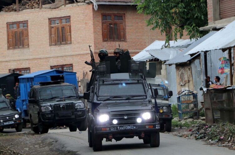 Army personnel at the encounter site in Khanday Pora in Kulgam