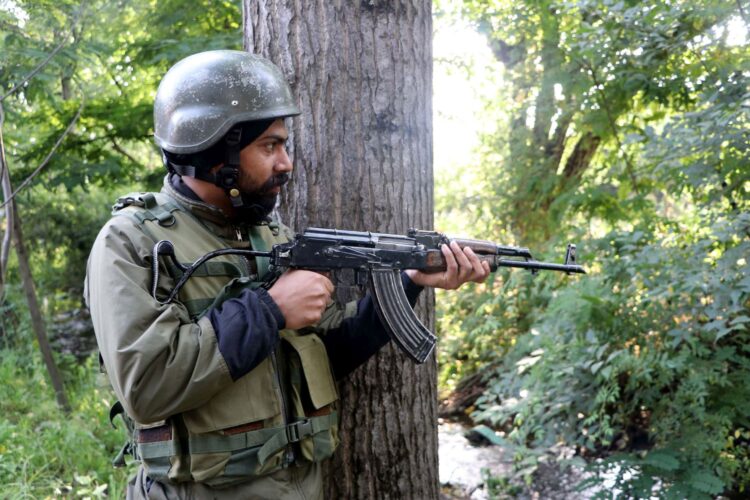 Army personnel at the encounter site in Khanday Pora in Kulgam