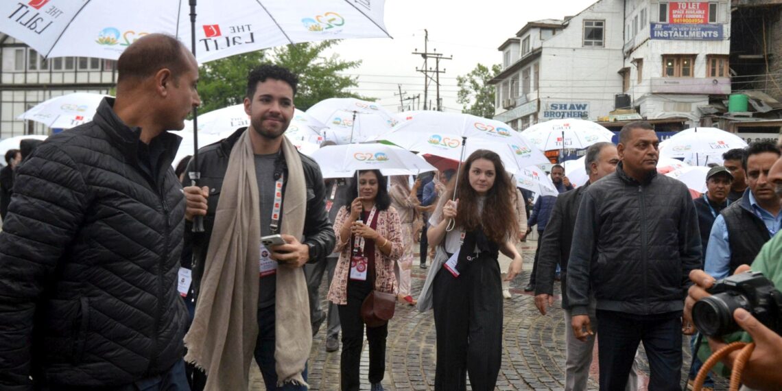 A group of foreign delegates of G20 visits market amid rain in Srinagar