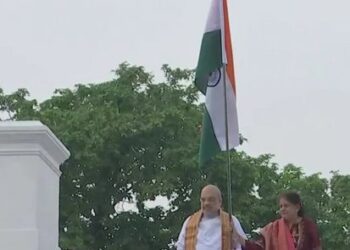 HM Amit Shah hoists flag at his residence, Urges people to raise National Flag at their homes