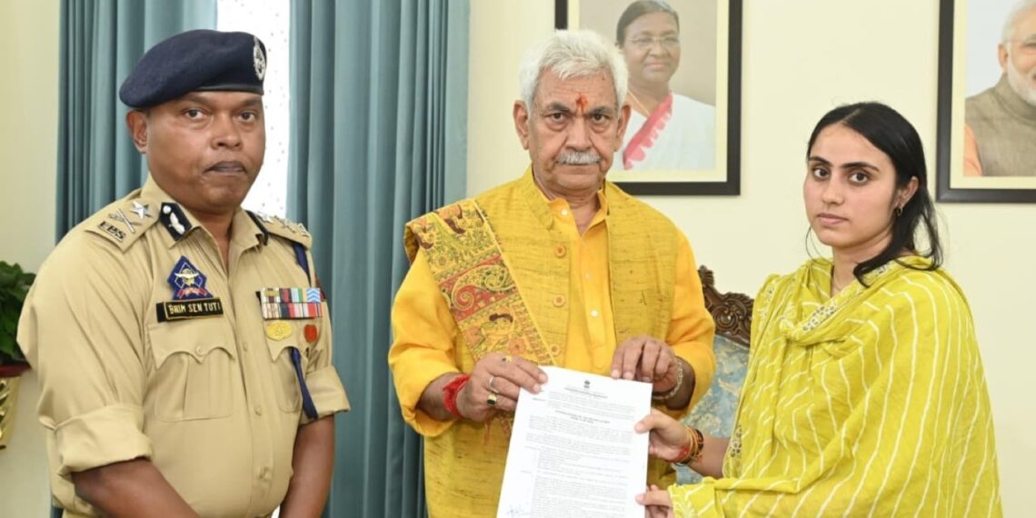 LG Manoj Sinha hands over Job letter to Wife of slain SI Deepak Sharma
