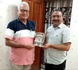 Pran Pandit SP (Retd) presents his book to DGP J&K