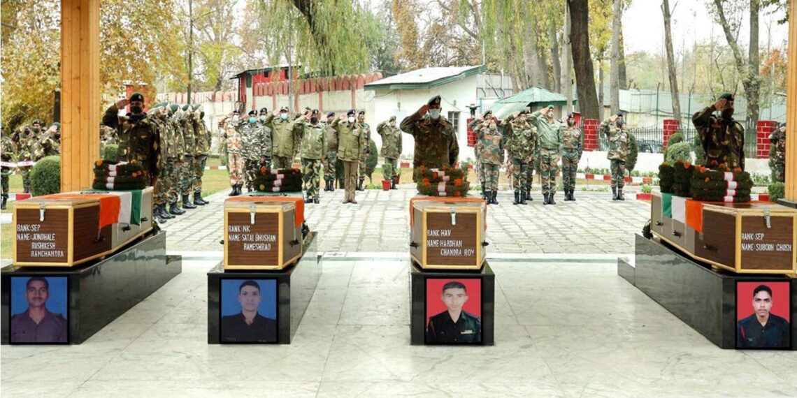 Senior Army officers paying tribute to four soldiers