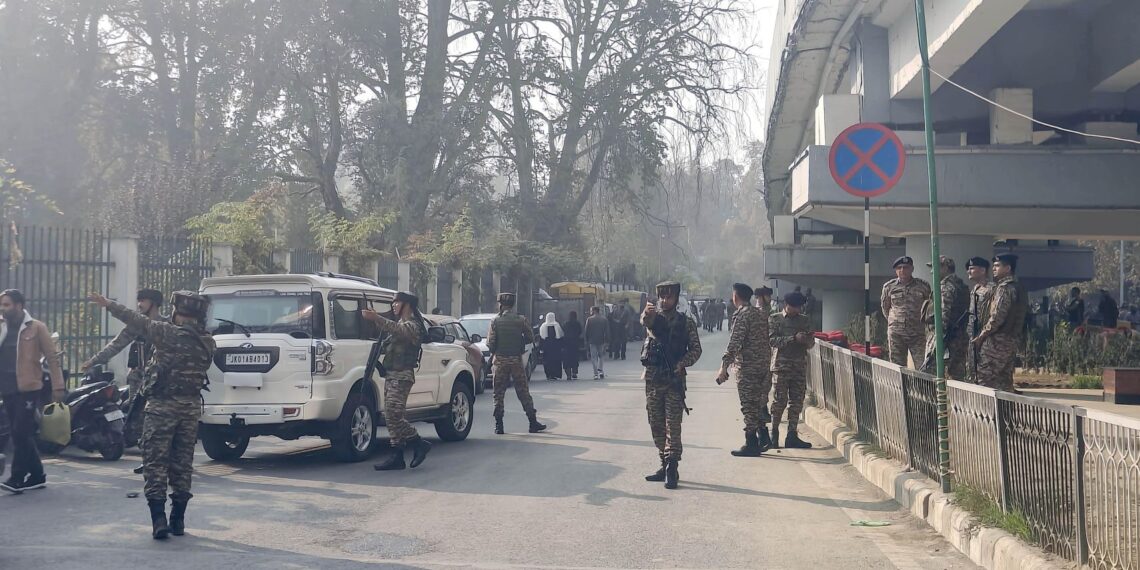 Security forces inspecting the blast site after militants a hand grenade in crowded Sunday market near TRC in Srinagar