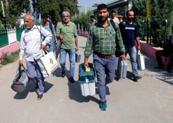 Polling officials leave after collecting EVM & other election material ahead of 2nd phase assembly elections in Srinagar
