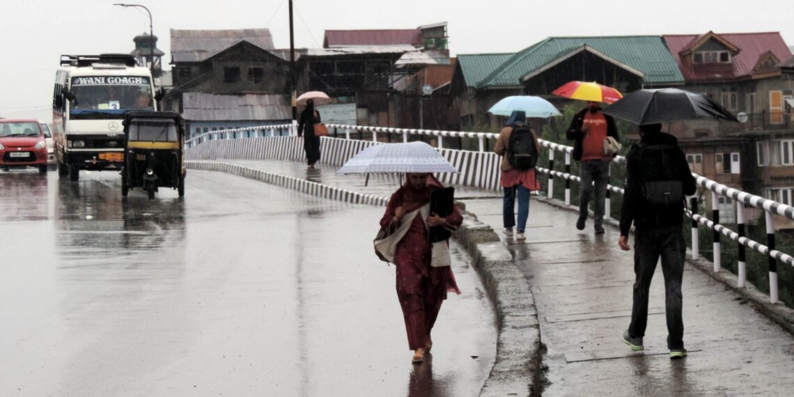 In Pictures- Rains lashes plains, upper reaches experiences snowfall in Kashmir