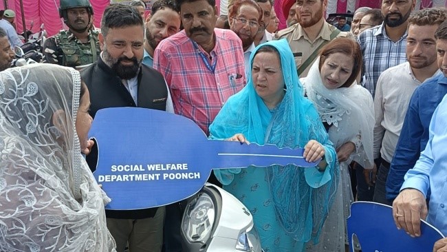 Sakeena Itoo distributes motorized Tricycles among specially abled persons at Poonch