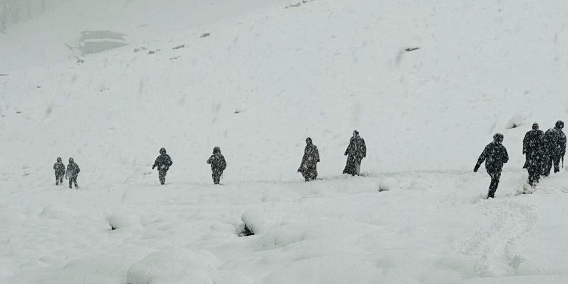 In Pictures- Rains lashes plains, upper reaches experiences snowfall in Kashmir