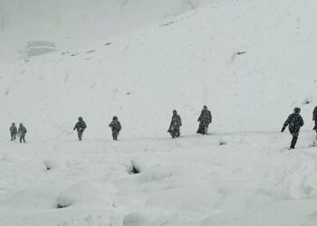 In Pictures- Rains lashes plains, upper reaches experiences snowfall in Kashmir