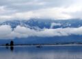 In Pictures- Rains lashes plains, upper reaches experiences snowfall in Kashmir